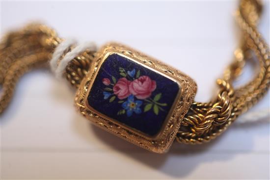 An early 20th century gold triple strand Albertina ropetwist chain, with floral enamelled plaques, gross 38.8 grams.